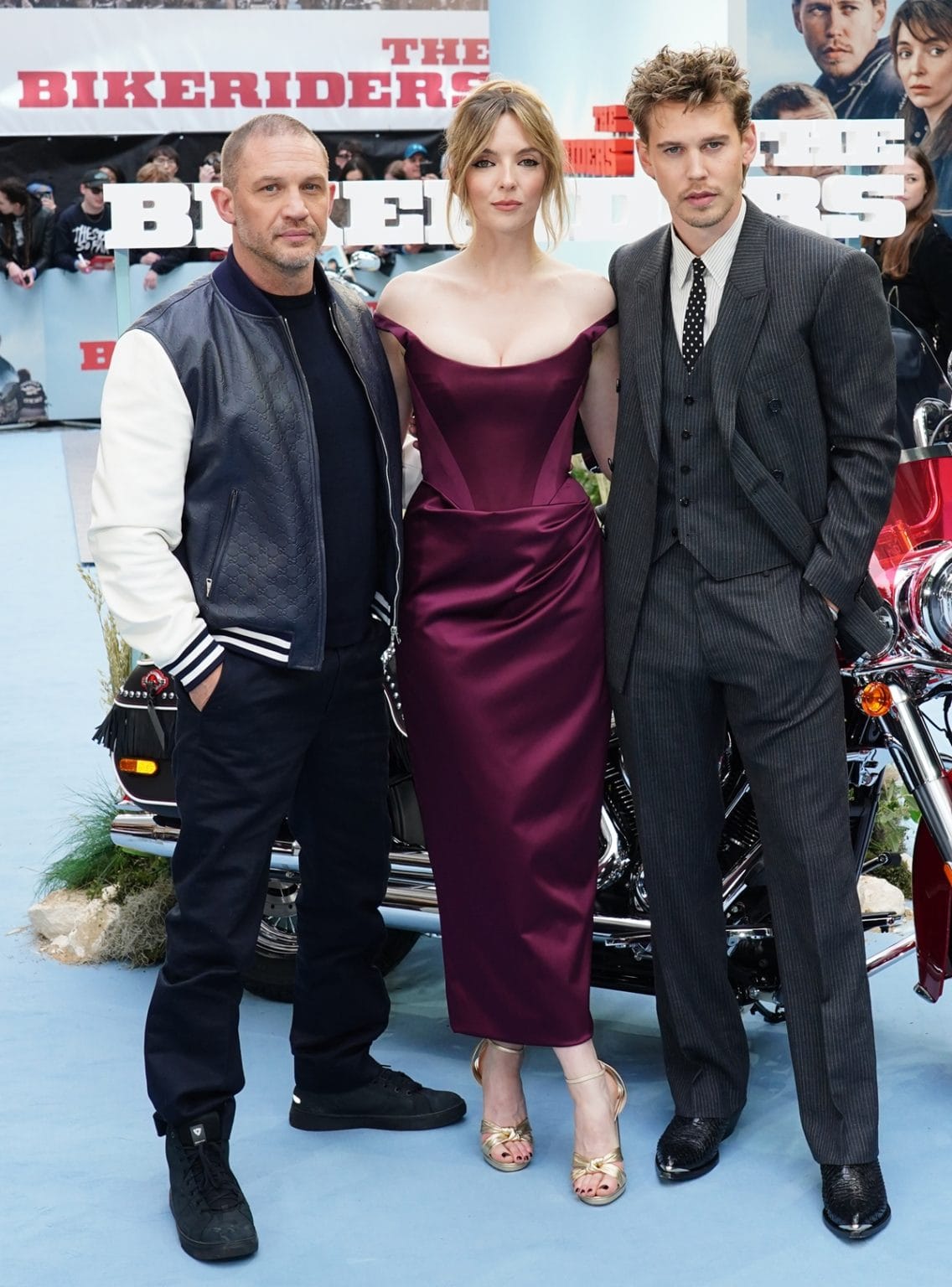 Jodie Comer Dazzles in Burgundy Vivienne Westwood Corseted Dress and Gold Jimmy Choo Sandals at The Bikeriders London Premiere