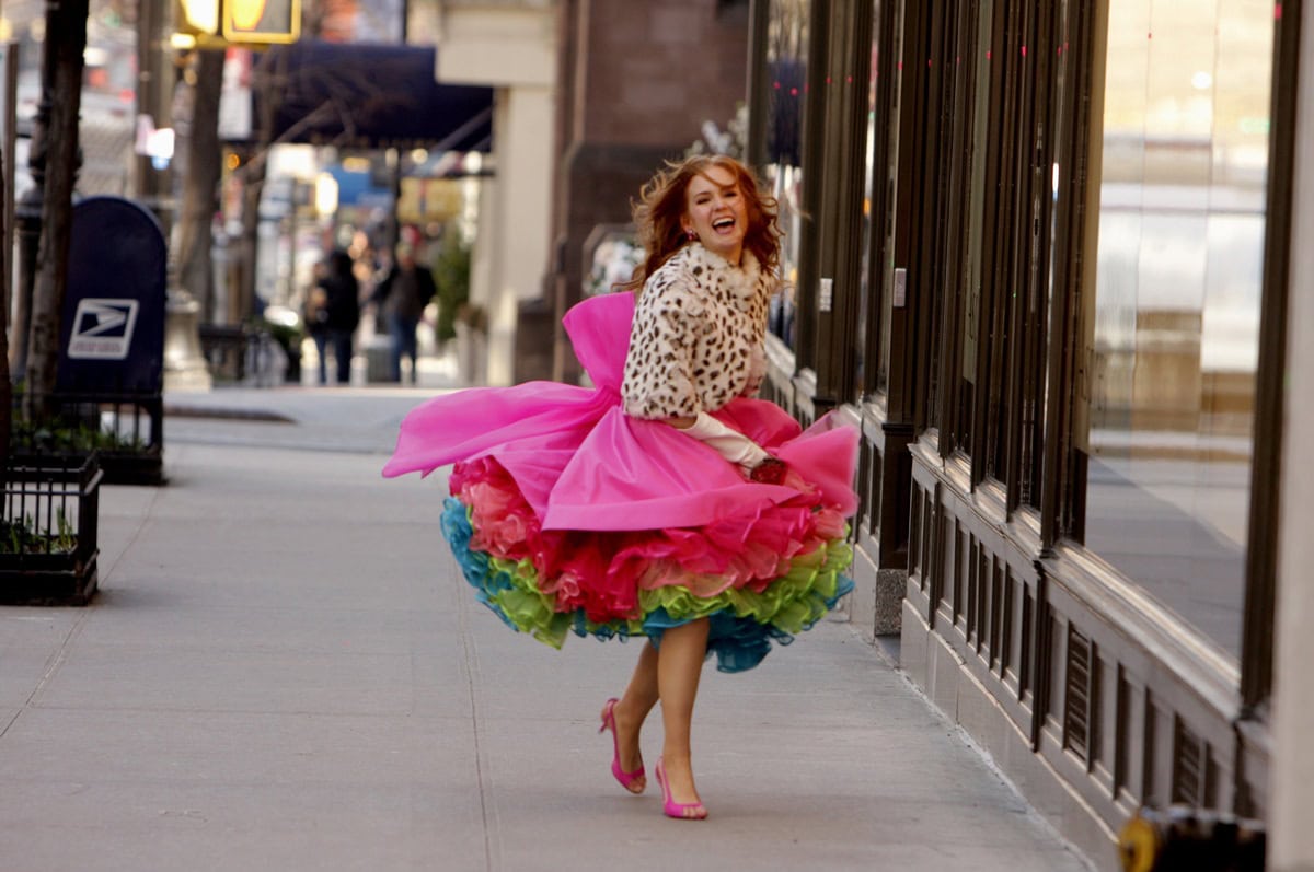 Rebecca Bloomwood (Isla Fisher) pairs her vibrant pink tutu skirt with matching pink slingback heels, adding a playful yet chic touch to her shopaholic style in Confessions of a Shopaholic (Credit: Walt Disney Studios Motion Pictures)