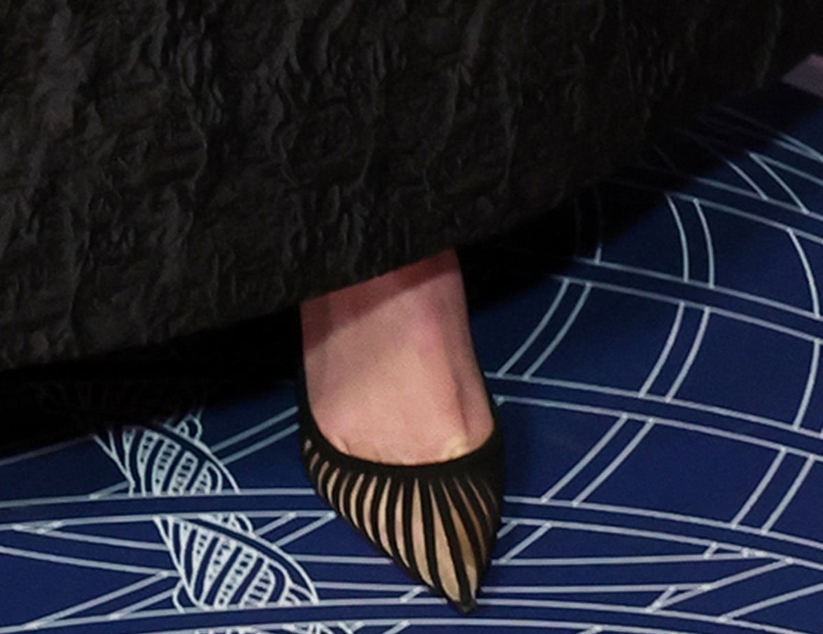 Olivia Wilde makes her way to the Barker Hangar in Aquazzura's Passions Pumps featuring luxurious black suede and nude mesh inserts, creating a caged effect