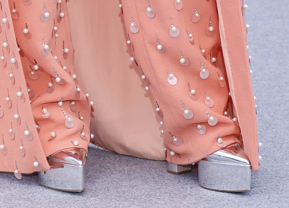 Angela Bassett teams her peach ensemble with mirror metallic platform pumps with pointed toes and chunky platforms