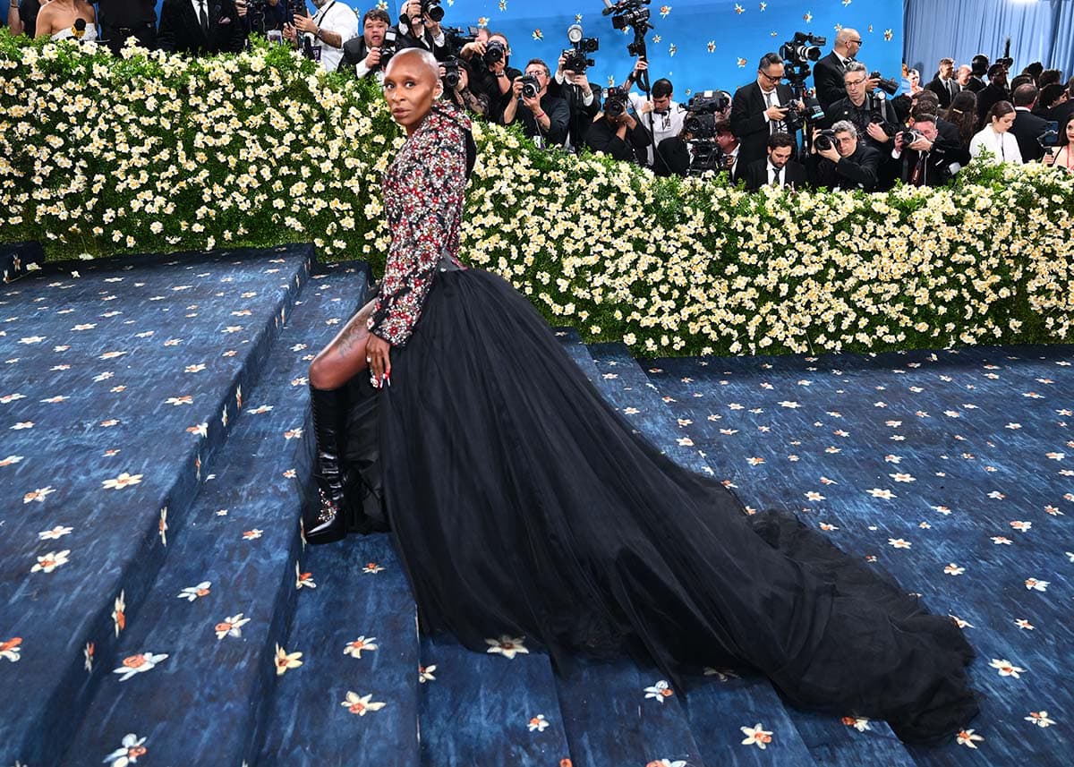 Cynthia Erivo embraces Rococo extravagance with a hint of a gothic flair in a custom Givenchy gown featuring a Swarovski-embellished jacket, corset, and a voluminous tulle skirt with a dramatic train