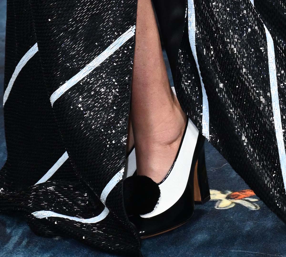 Demi Moore dons black and white Thom Browne Opera pumps with wingtip and pompom-accented vamps