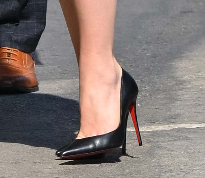 Florence Pugh completes her head-to-toe black look with the classic Christian Louboutin Iriza d'Orsay pumps