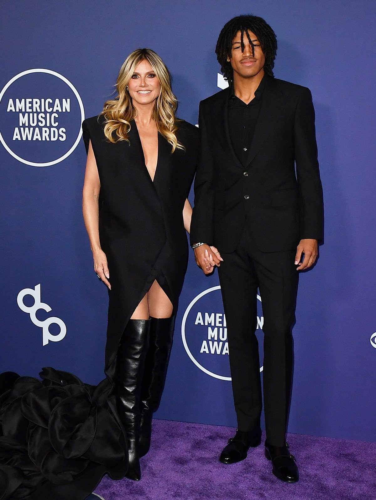 Heidi Klum and son Henry matchy matchy in black ensembles at the 2025 American Music Awards at Fontainebleau Las Vegas in Las Vegas, Nevada
