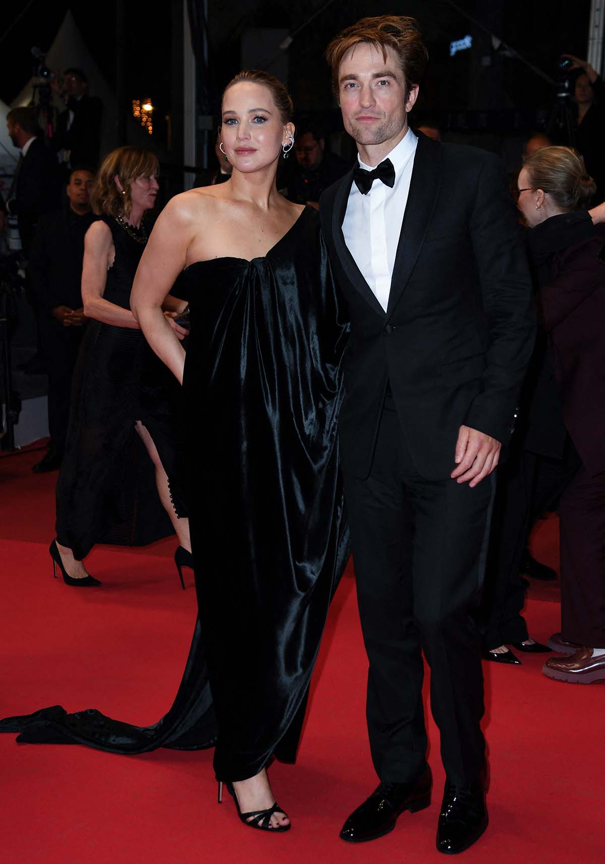 Jennifer Lawrence swaps her white Dior gown for a black velvet draped gown following the movie premiere