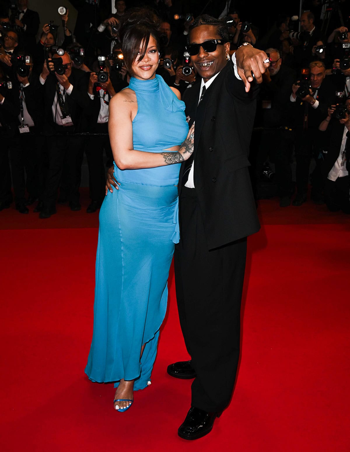 Rihanna and A$AP Rocky turned heads at the Cannes Film Festival premiere of Highest 2 Lowest, with Rihanna glowing in a turquoise Alaïa gown and Rocky keeping it cool in an oversized black suit and shades