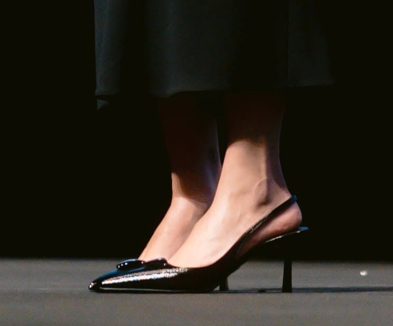 Scarlett Johansson completes her head-to-toe black Prada look with slingback pumps featuring a 3D padded logo accent at the vamps