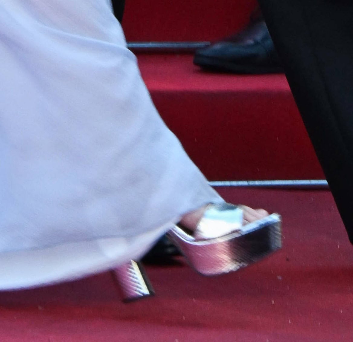 Scarlett Johansson pairs her dusty blue Prada gown with metallic silver platform pumps with chunky heels
