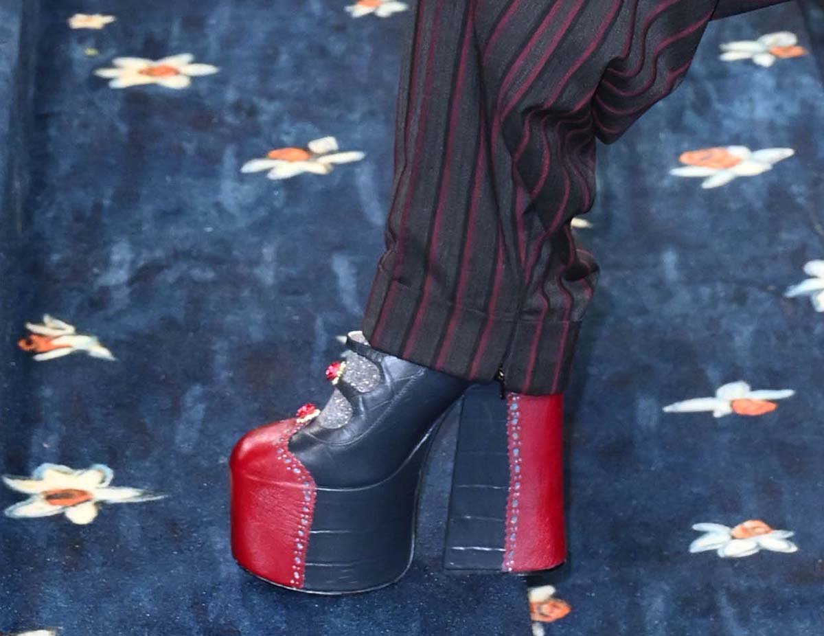 Teyana Taylor brings her signature edge to the blue carpet in black and red Marc Jacobs Kiki boots with tiny roses on the straps that nod to Teyana's 2018 song Rose in Harlem