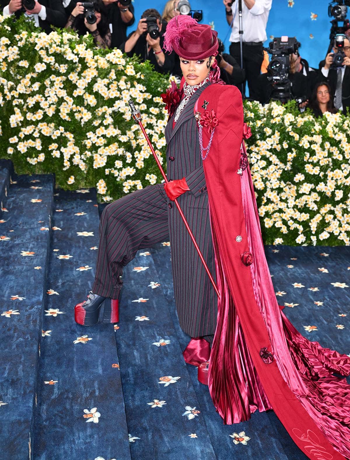Teyana Taylor looks magnificent in a zoot suit she designed with Oscar-winning costume designer Ruth E. Carter and a dramatic cape with Renaissance brooches