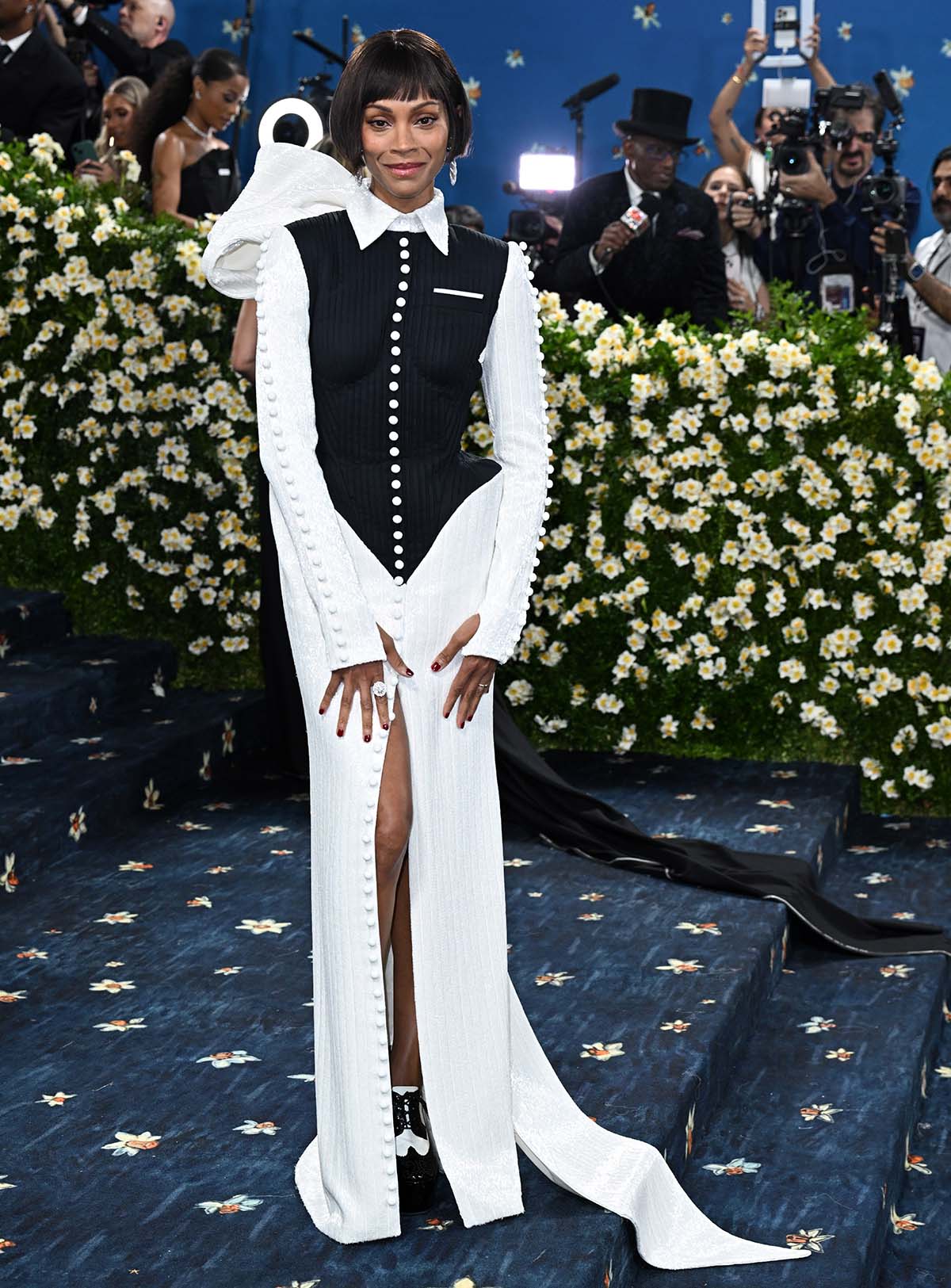 Zoe Saldana teams her brogues with a black and white tuxedo dress featuring a black plissé piqué bodice and 2.7 million white bugle beads