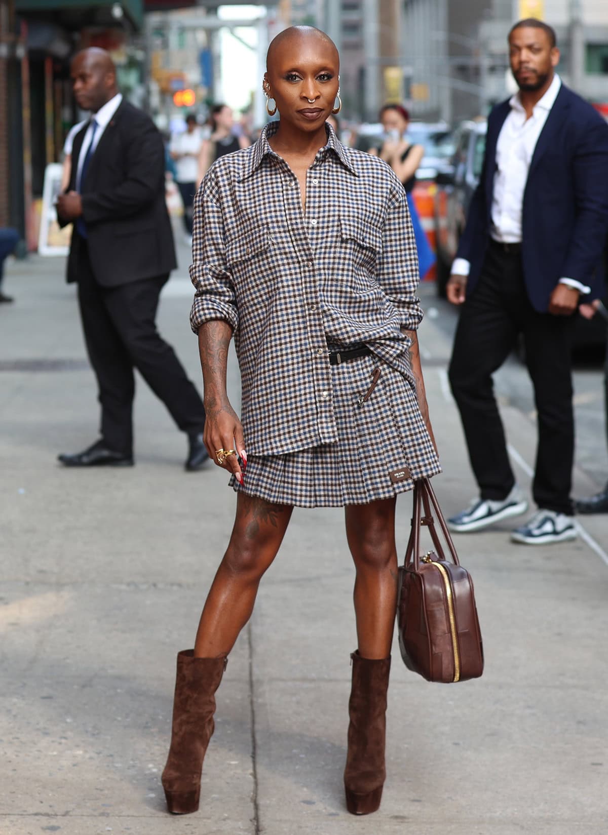 Cynthia Erivo drops by The Late Show with Stephen Colbert in a preppy checkered shirt and pleated mini skirt by Prada to talk about her new album, I Forgive You, and upcoming musical fantasy movie, Wicked: For Good