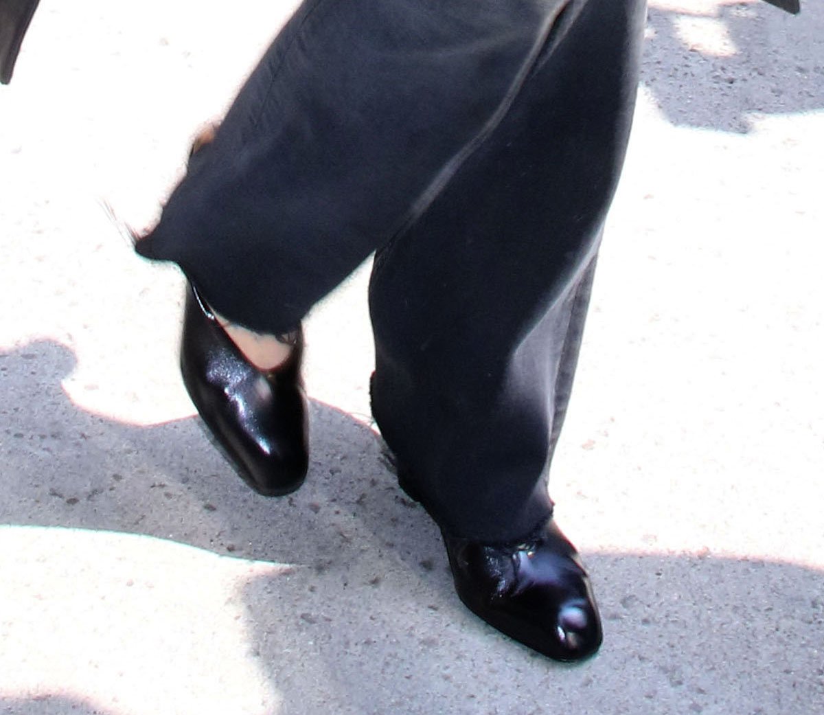 Dakota Johnson completes her head-to-toe black ensemble with the Khaite Colt shoes featuring sculptural wedge heels and snip-toes