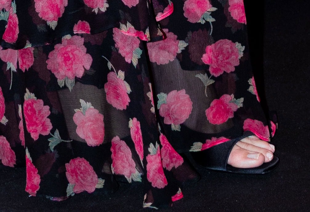Kristin Davis pairs her black and pink floral dress with open square toe heels