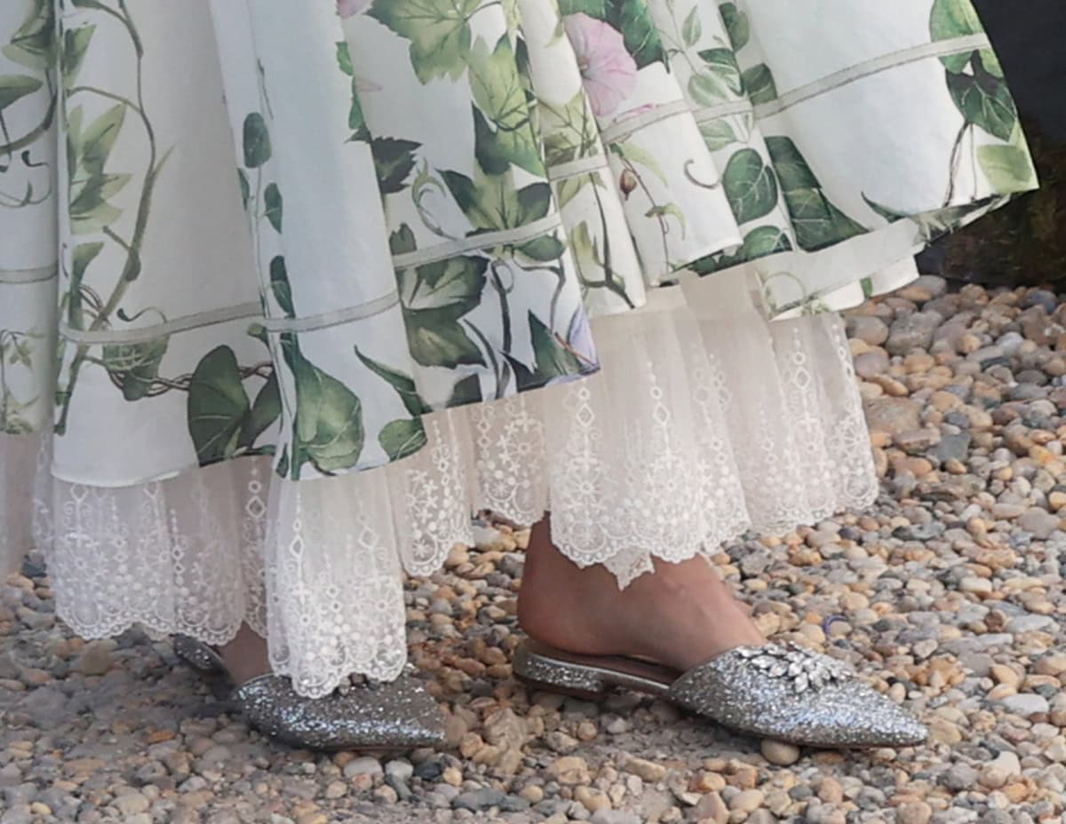 Olivia Palermo completes her sophisticated summer look with glittery silver mules with crystal accents by Miu Miu