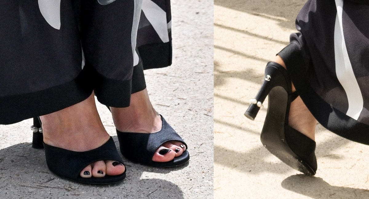 Keira Knightley teams her striking Chanel dress with black peep-toe sandals featuring open toes and pearl accents encircling the base of the heels