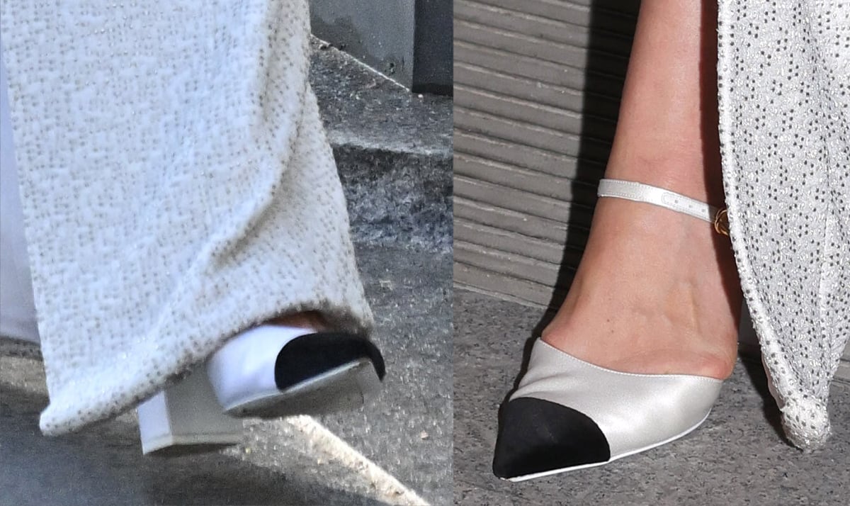 Keira Knightley completes her classy ensemble with white satin pumps featuring black cap toes, slim Mary Jane straps, and block heels