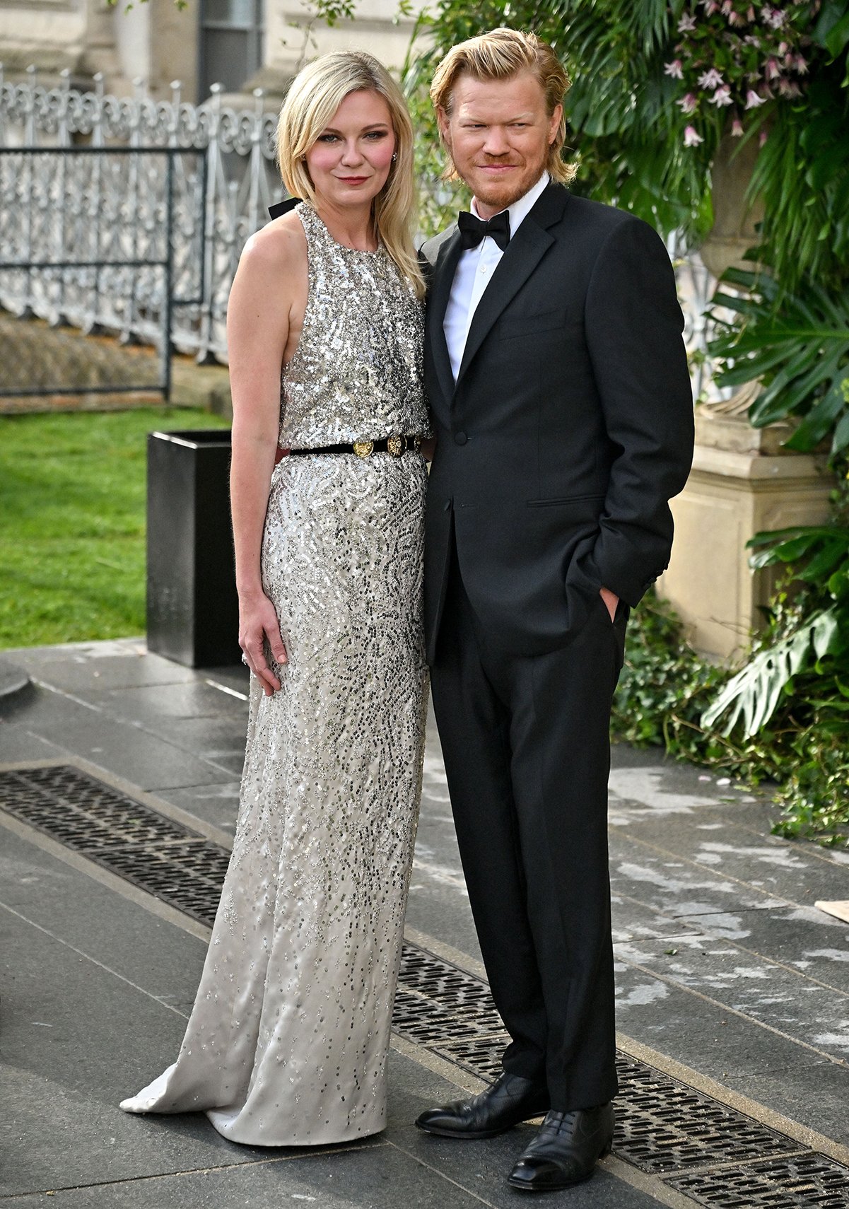 Kirsten Dunst, pictured with her husband Jesse Plemons, shines in a sequin-embellished halter gown by Chanel at the 2025 Bal d’Été