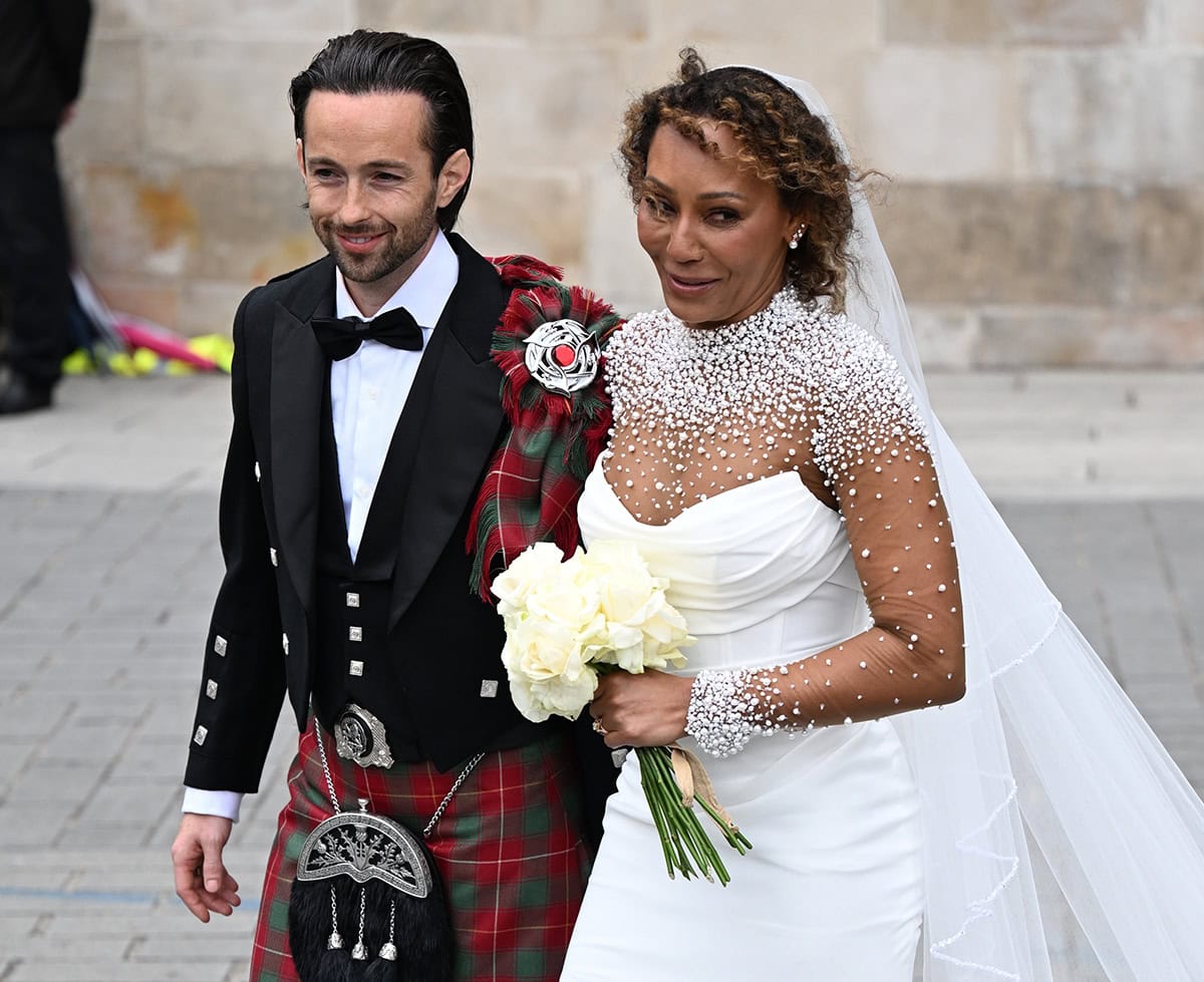 Mel B dazzles with minimal jewelry, highlights her beauty with smokey eyes and mauve lipstick, and styles her hair in tight curls