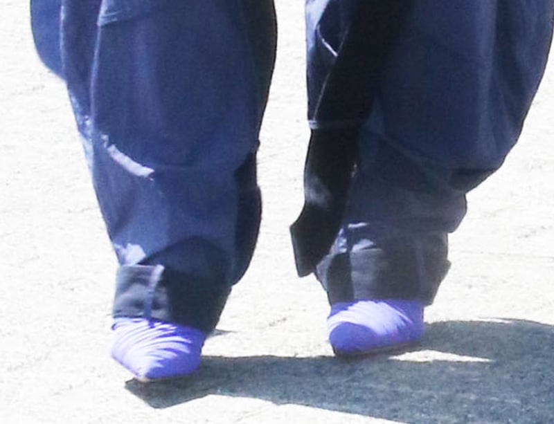 Rita Ora elevates her laid-back summer style with pointy purple pumps with ruched vamps