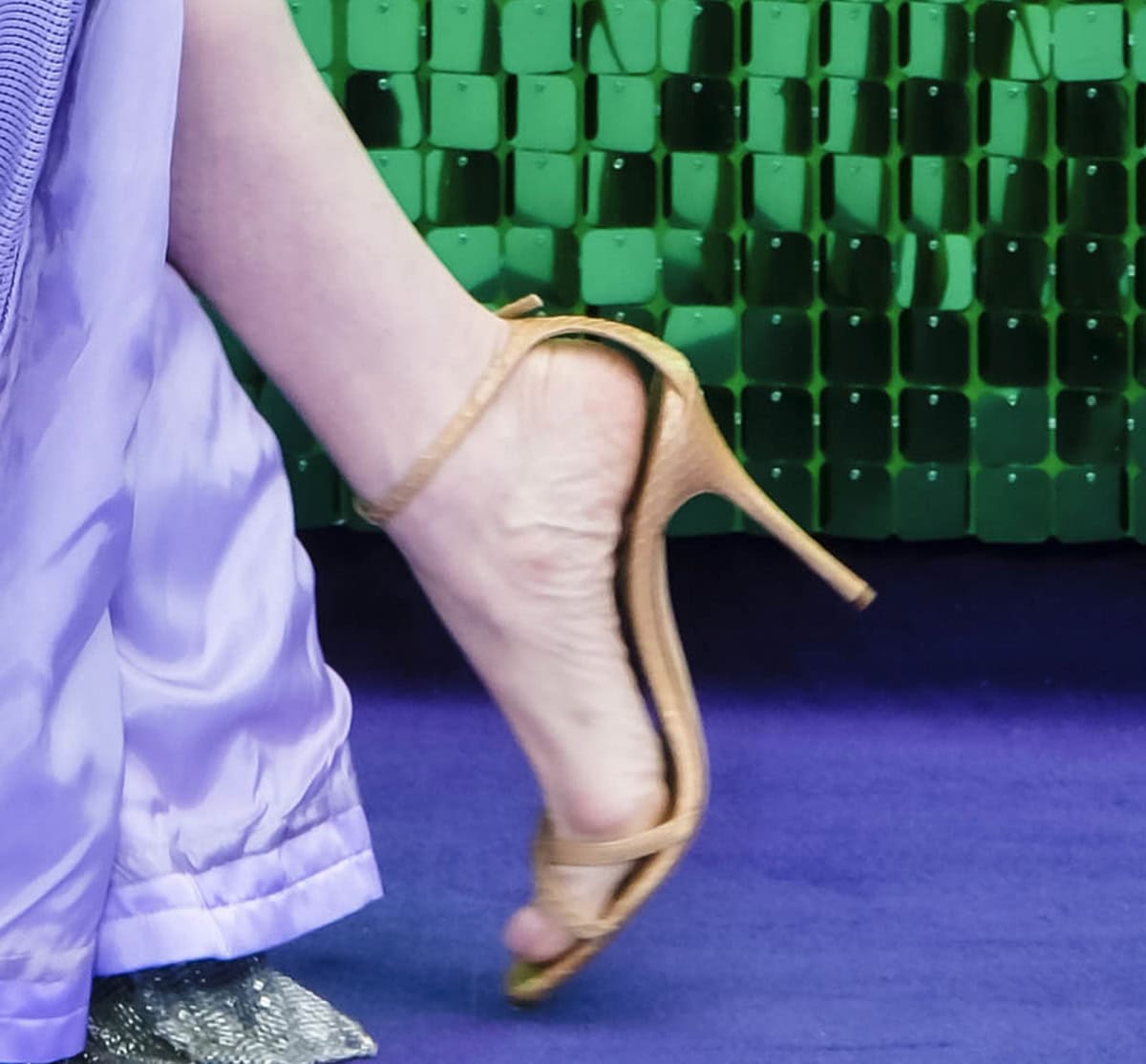 Lindsay Lohan pairs her lavender gown with minimalist beige watersnake sandals by Manolo Blahnik