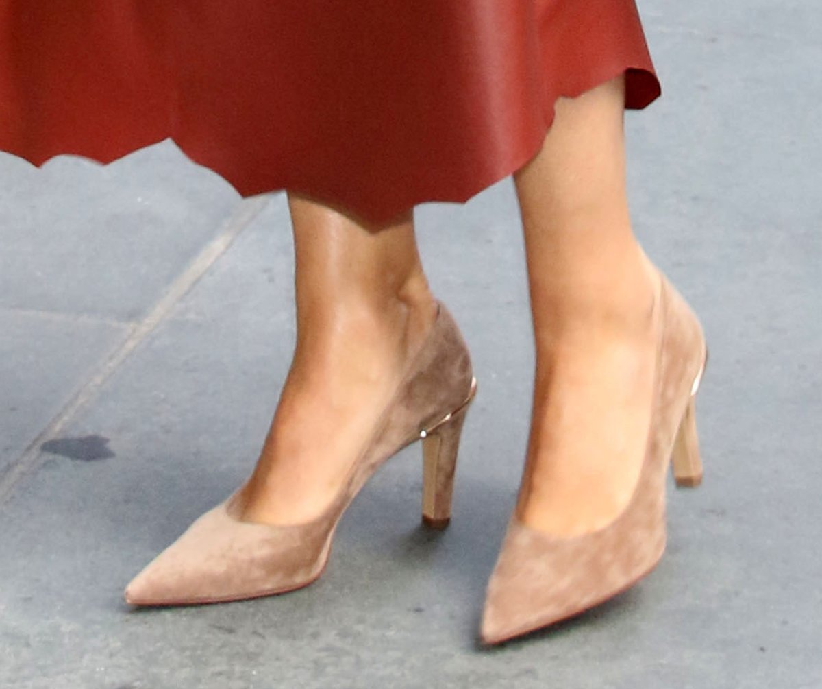 Maria Sharapova completes her sophisticated earth-toned ensemble with nude suede Gabriela Hearst Edwina pumps featuring a gold brass detail at the heel