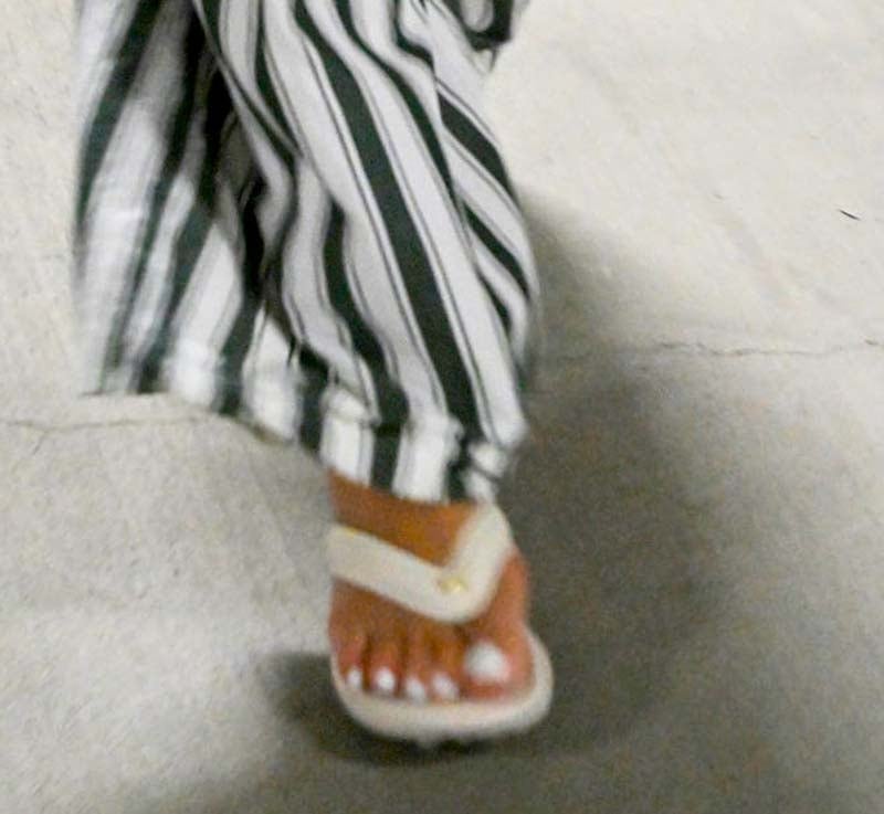 Rihanna adds a sporty twist to her maternity look with Puma x Fenty Cat Cleat slides, featuring cleat-inspired soles and a playful retro vibe