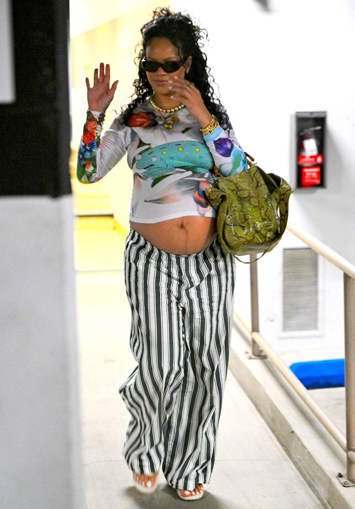 Pregnant Rihanna steps out in Beverly Hills on August 25, 2025, showing off her maternity glow in a quirky Chopova Lowena top, Savage x Fenty striped pants, and a vintage Gucci python bag