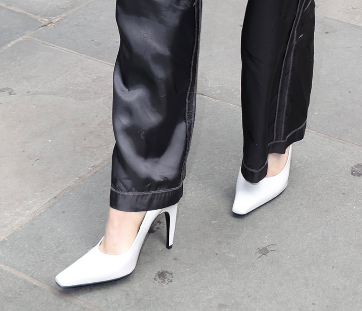 Chloë Grace Moretz pairs her monochromatic ensemble with the popular Jude "Fame" pumps in brushed white leather, creating a sharp, modern contrast