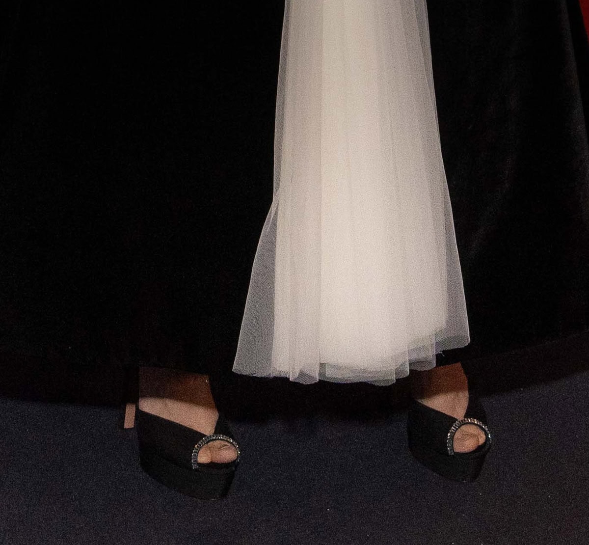 Amanda Seyfried completes her head-to-toe black-and-white ensemble with Aquazzura's "Be Mine" sandals featuring a chiffon upper, crystal trims, peep toes, platforms, and high heels