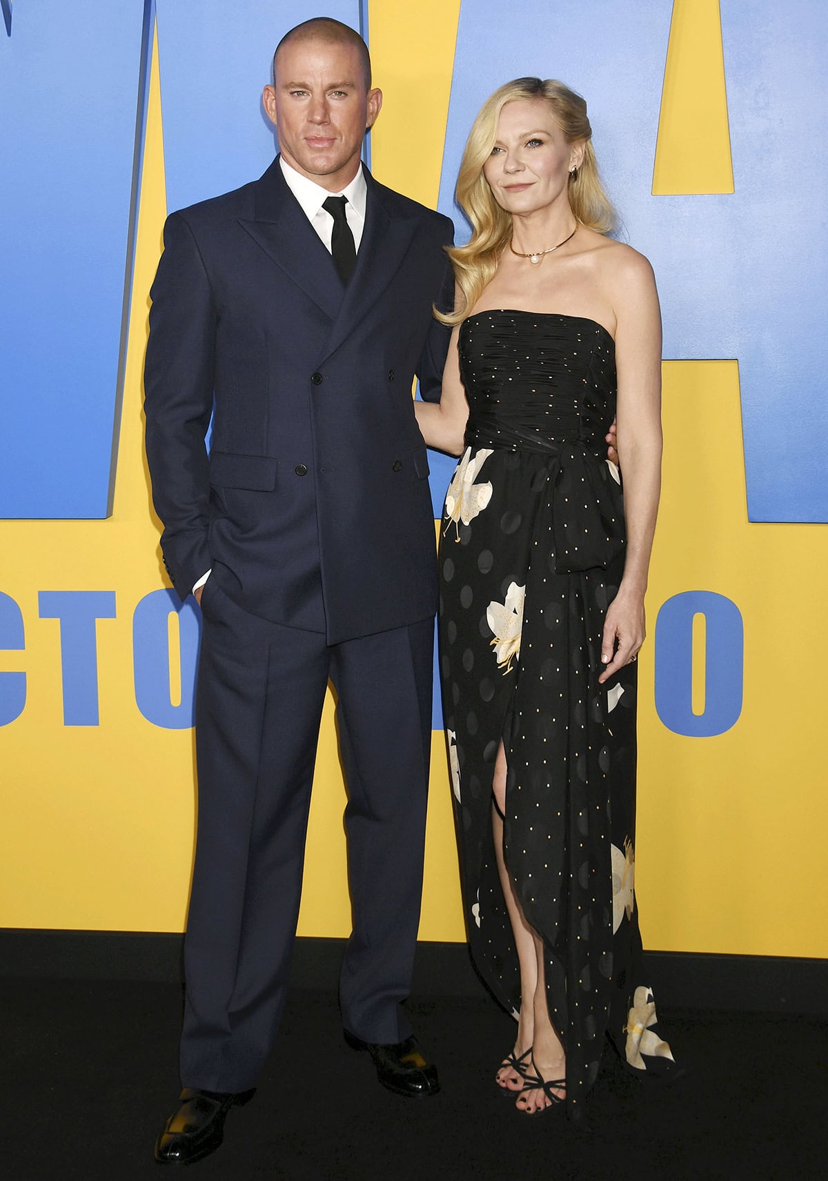Channing Tatum and Kirsten Dunst attend the Los Angeles premiere of Paramount Pictures’ “Roofman” at the Paramount Theatre on September 29, 2025, with Kirsten stunning in a strapless black Valentino gown and strappy Aquazzura sandals alongside Channing in a classic navy suit