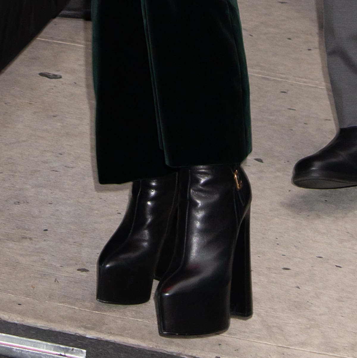 Demi Moore completes her fall-perfect outfit with the Saint Laurent "Nico" knee-high boots with chunky platforms and towering block heels