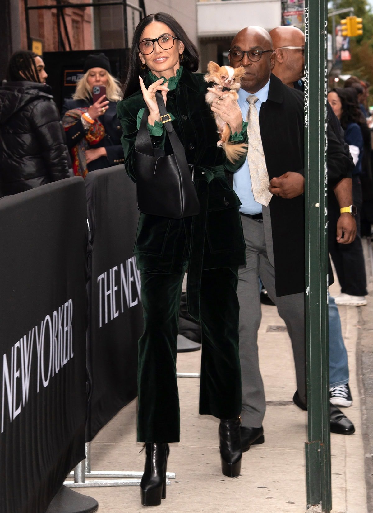 Demi Moore radiates effortless fall glamour outside Webster Hall, arriving for the New Yorker Festival in a forest-green velvet Saint Laurent suit paired with towering black platform boots on October 25, 2025, in New York City