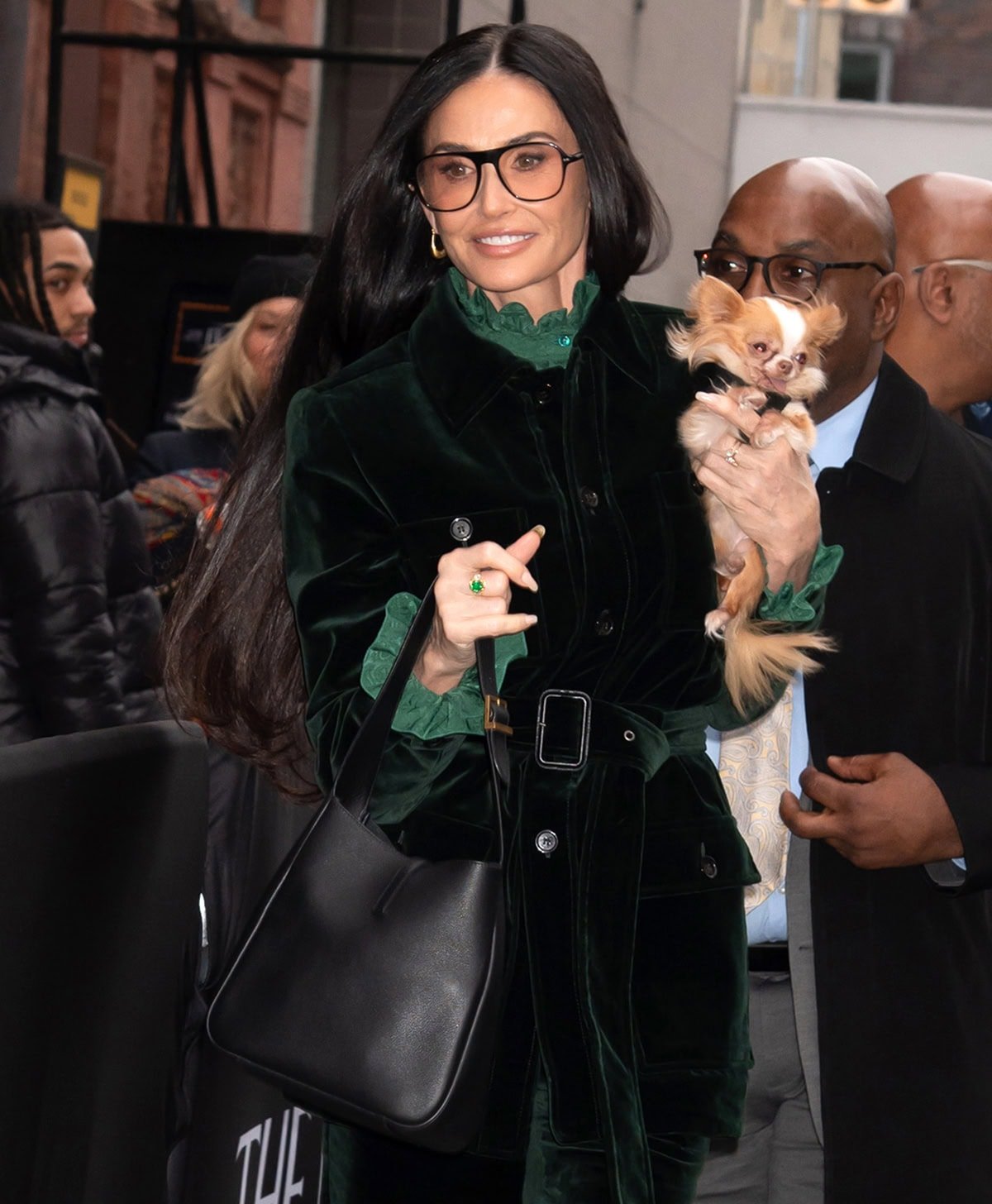 Demi Moore carries a Saint Laurent 5 a 7 bag in one hand and her dog Pilaf in the other