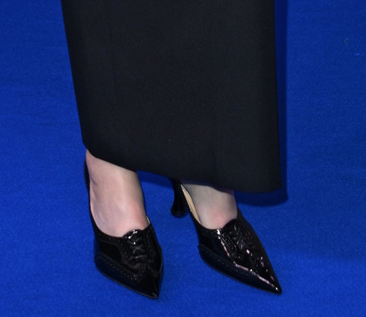 Demi Moore completes her chic schoolgirl look with Thom Browne pumps-oxford hybrid featuring pointed toes with lace-up ties, pinked trims, and a wingtip