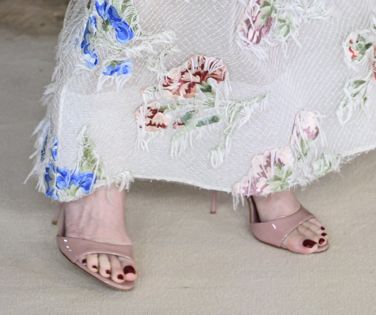 Demi Moore keeps her footwear simple, wearing just a pair of nude patent open-toe sandals to let her dress take center stage