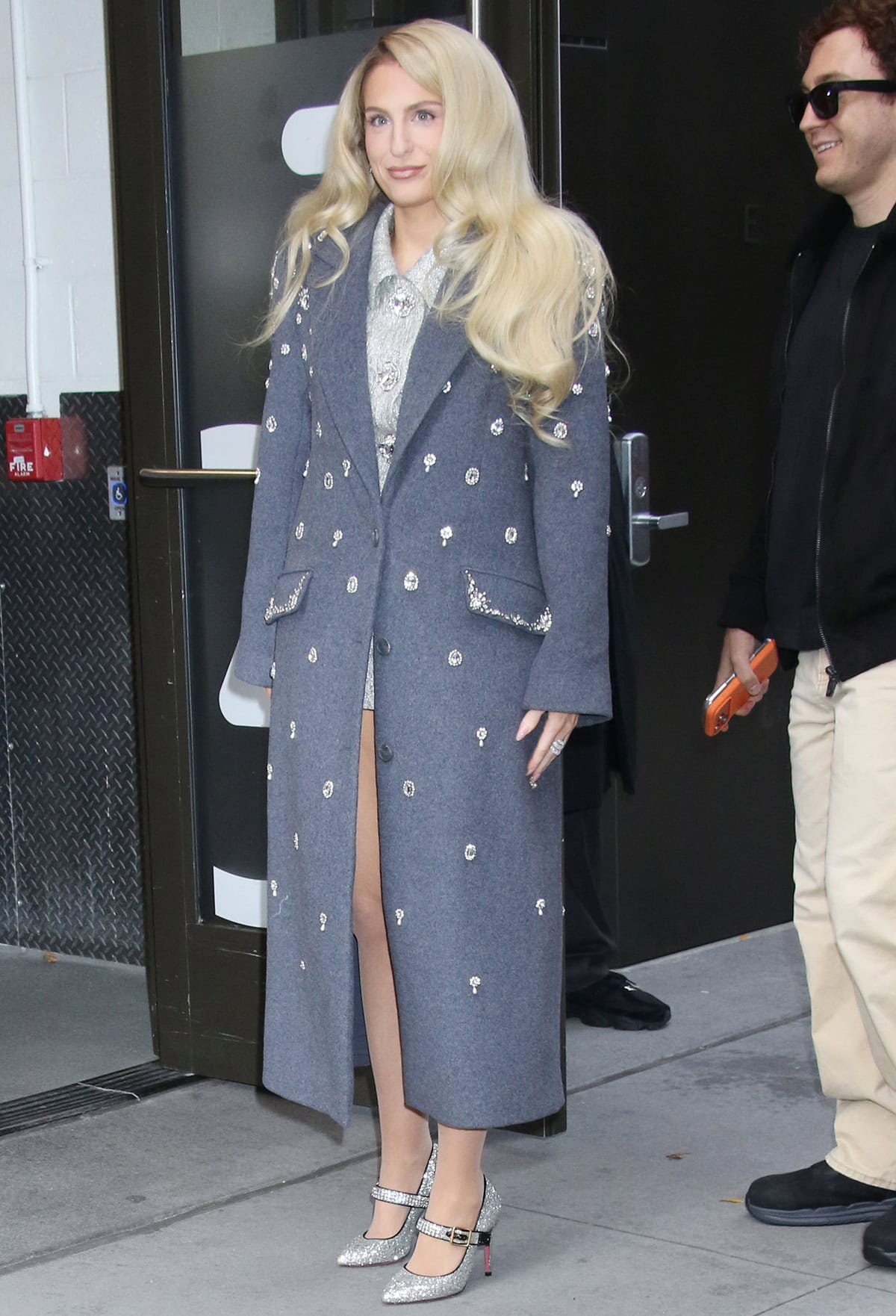 Meghan Trainor pairs her glittery Gucci Mary Janes with a bluish-gray crystal-embellished Jonathan Simkhai coat and a silver Nana Jacqueline skirt suit