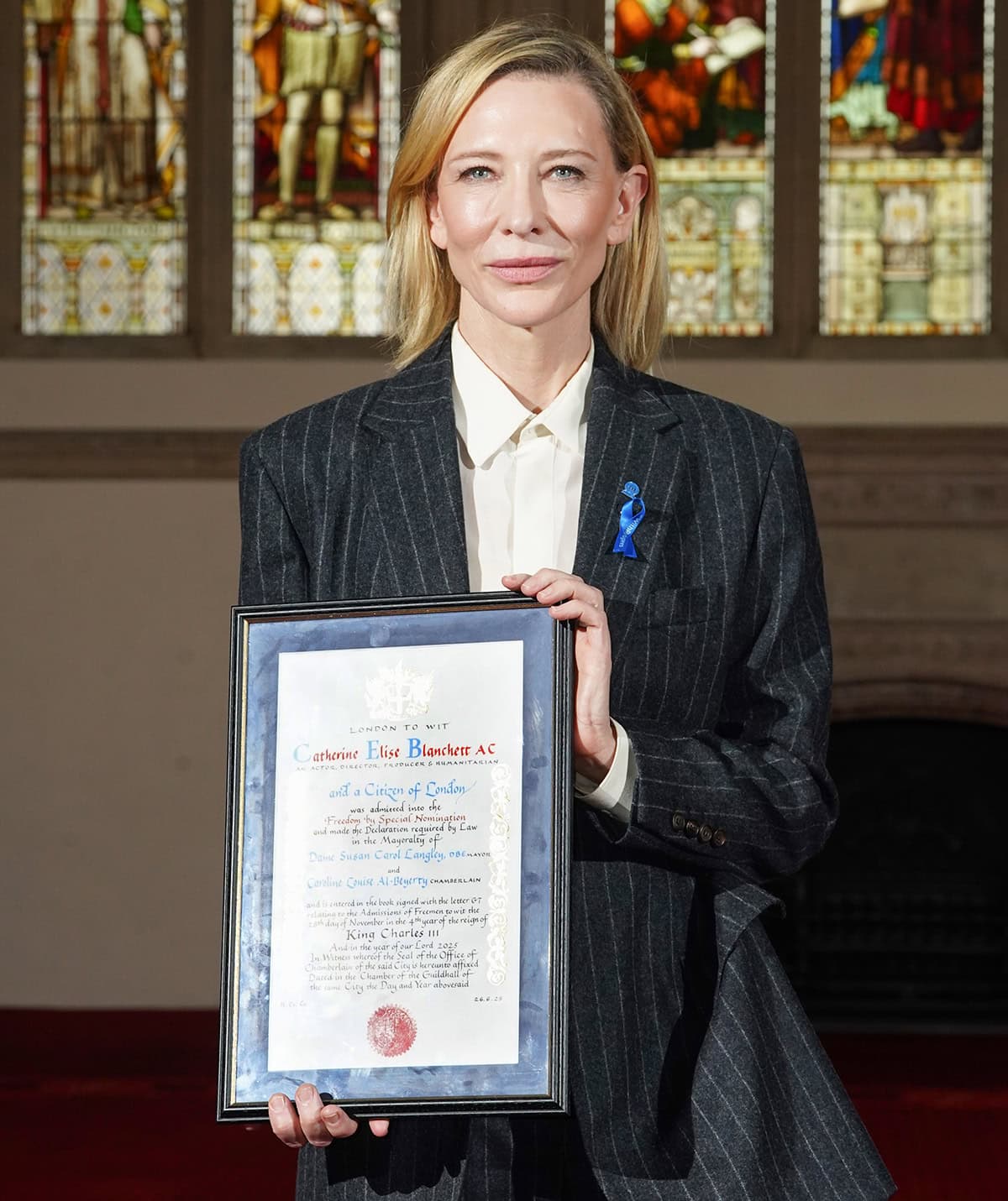 Cate Blanchett keeps her glam simple with soft pink makeup and a side-parted hairstyle