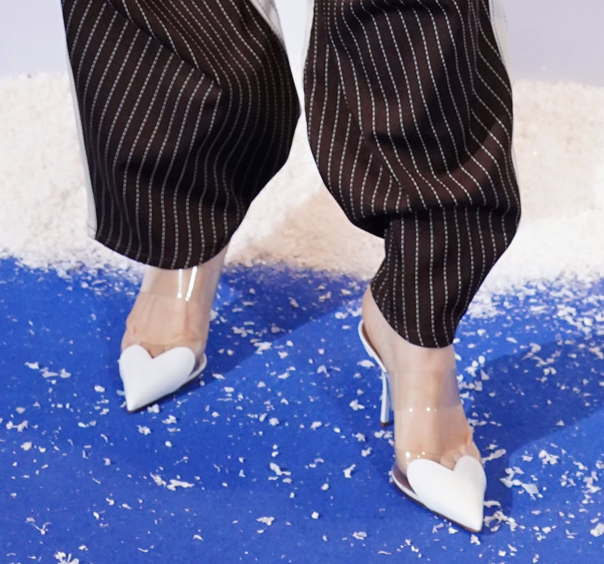 Jessie J brings a feminine touch to her outfit with the Alaïa “Le Cœur” pumps featuring a heart-shaped pointed toe and a clear PVC panel across the foot