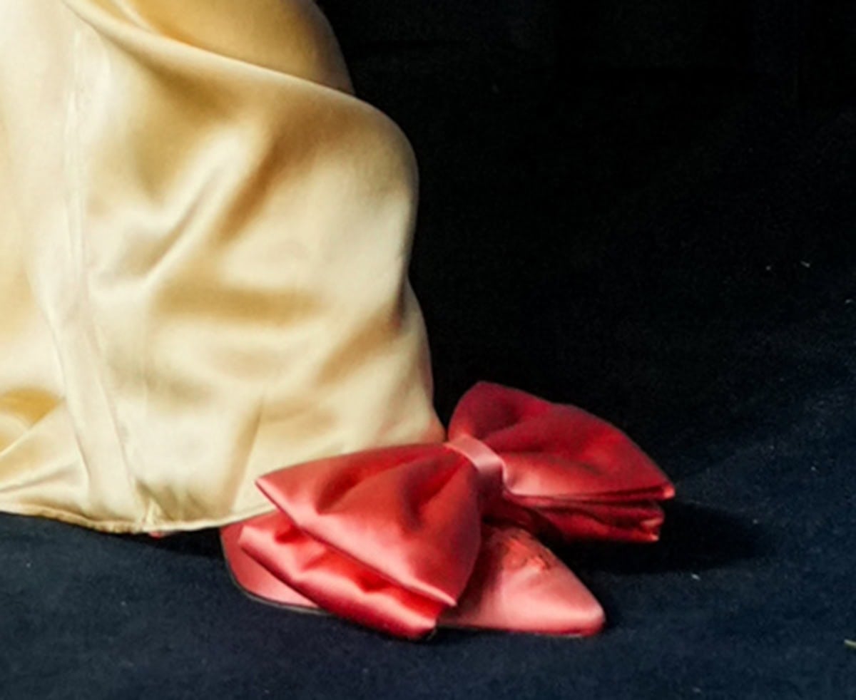 Lily Allen wears the bright pink satin Valentino "Yolande" mules featuring a large bow and corset-style lacing at the toes