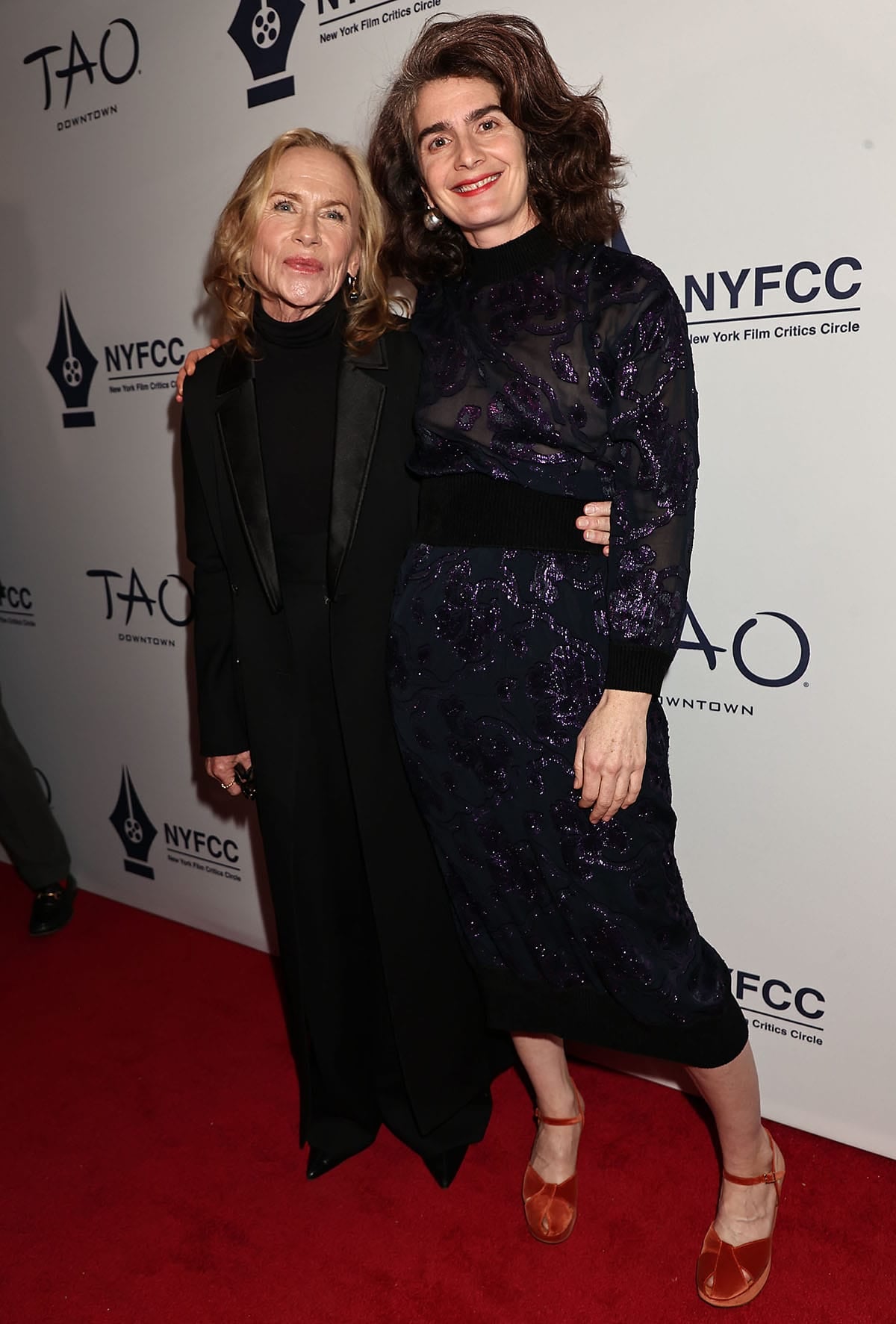 Gaby Hoffmann, with Best Supporting Actress winner Amy Madigan, shimmers in the Rachel Comey "Notte" sweater and "Vine" midi skirt, featuring a black mesh base with metallic purple floral embroidery