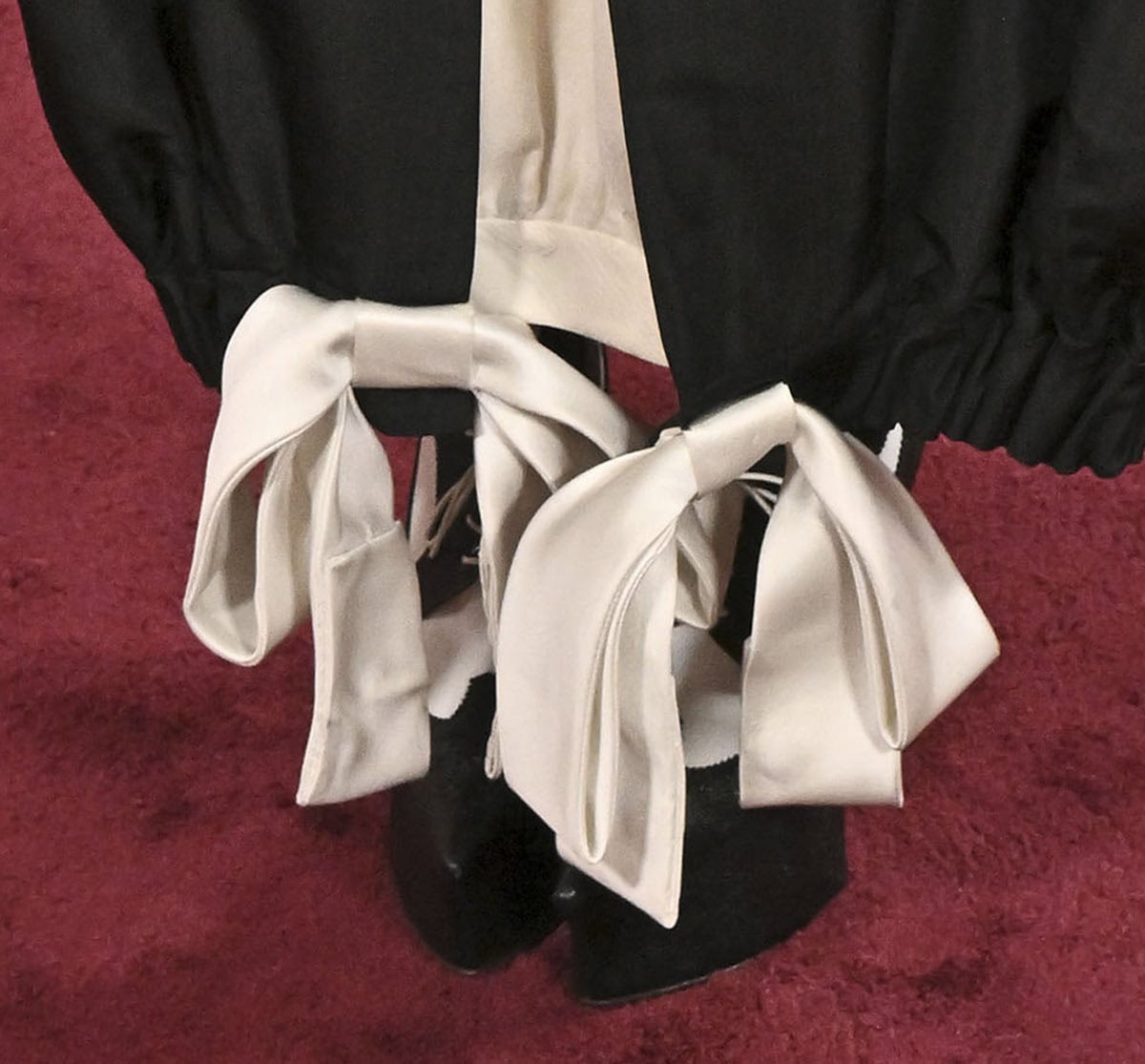 Audrey Nuna gives her height an extra boost with the black-and-white Thom Browne longwing brogues