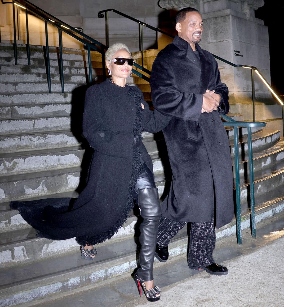 Jada Pinkett Smith pairs her punk-rock spiked heels with black leather pants, a loose tank top, and a fur coat