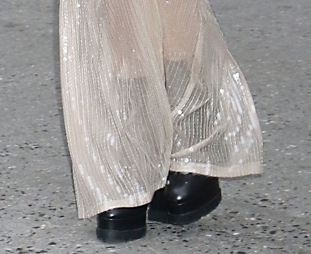 Kristen Stewart injects her signature tough-chic edge into her sultry dress with the black Casadei "Nancy" ankle boots