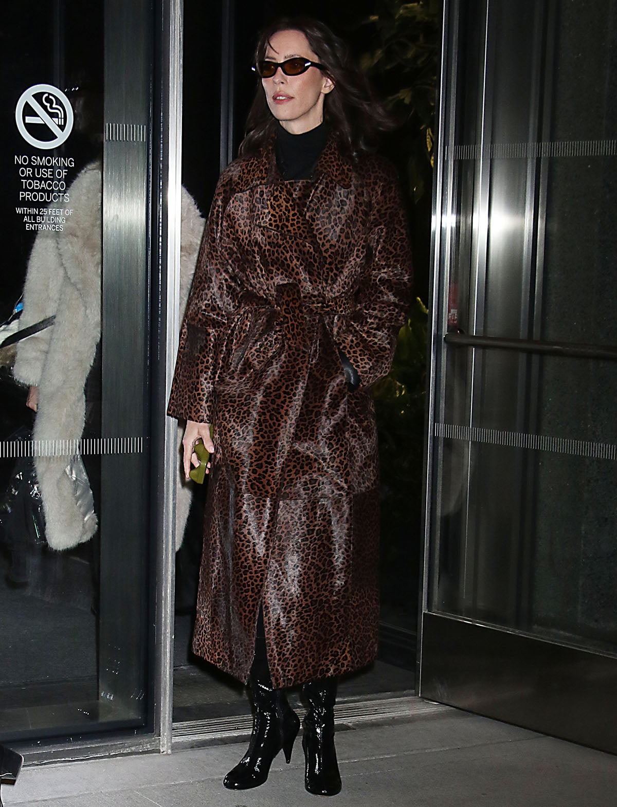 Rebecca Hall wears a leopard-print Nour Hammour coat with a black ribbed turtleneck underneath outside the ABC News Live Prime With Linsey Davis studios