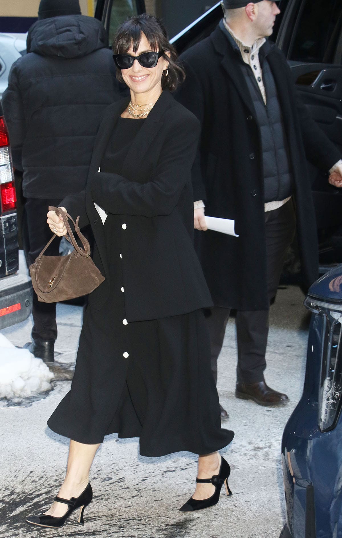 Constance Zimmer pairs her Mary Janes with an Edeline Lee buttoned midi skirt, a cropped top, and a single-breasted jacket