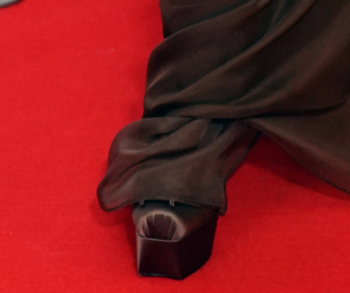 Cynthia Erivo slips into the ballet-inspired Christian Louboutin “Cassia” pumps in brown satin featuring squared toes, platforms, and a dainty bow at the vamp