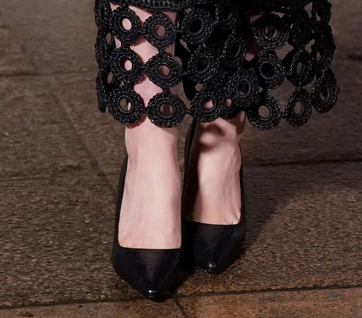 Daisy Edgar-Jones keeps her footwear simple, wearing a pair of glossy black pointed-toe pumps