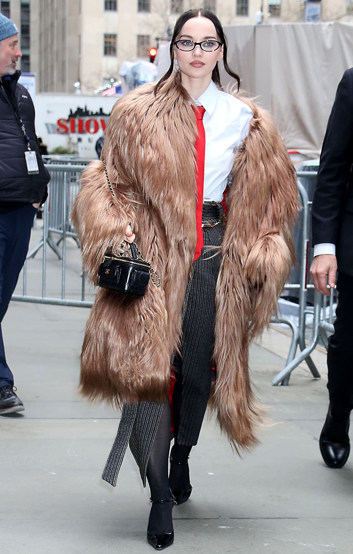 Dove Cameron nails office-core style in a tailored Ferrari ensemble, grounding the sharp look with sleek black patent Mary Jane pumps for her Today show appearance in New York City