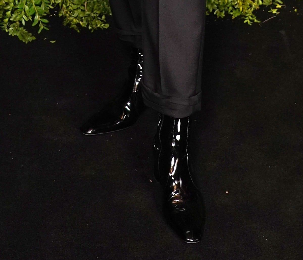 Gwendoline Christie completes her cool and edgy black-and-white look with glossy ankle boots